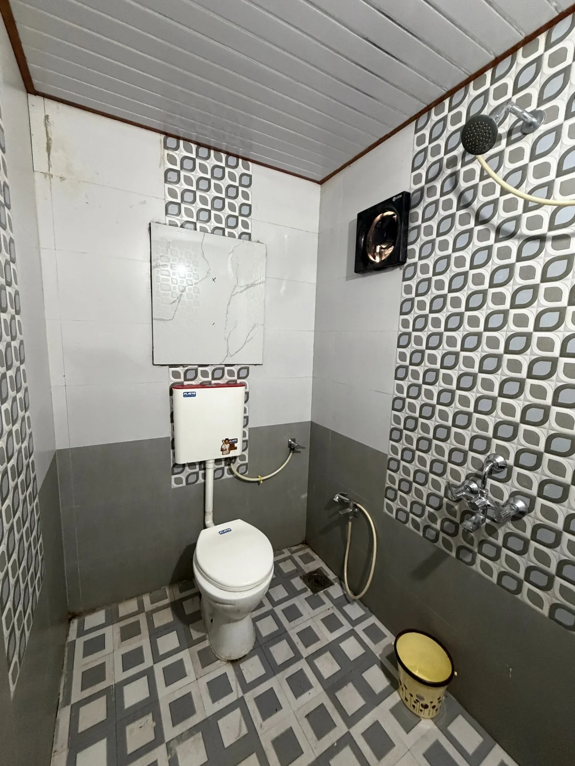 Clean bathroom with shower and western toilet
