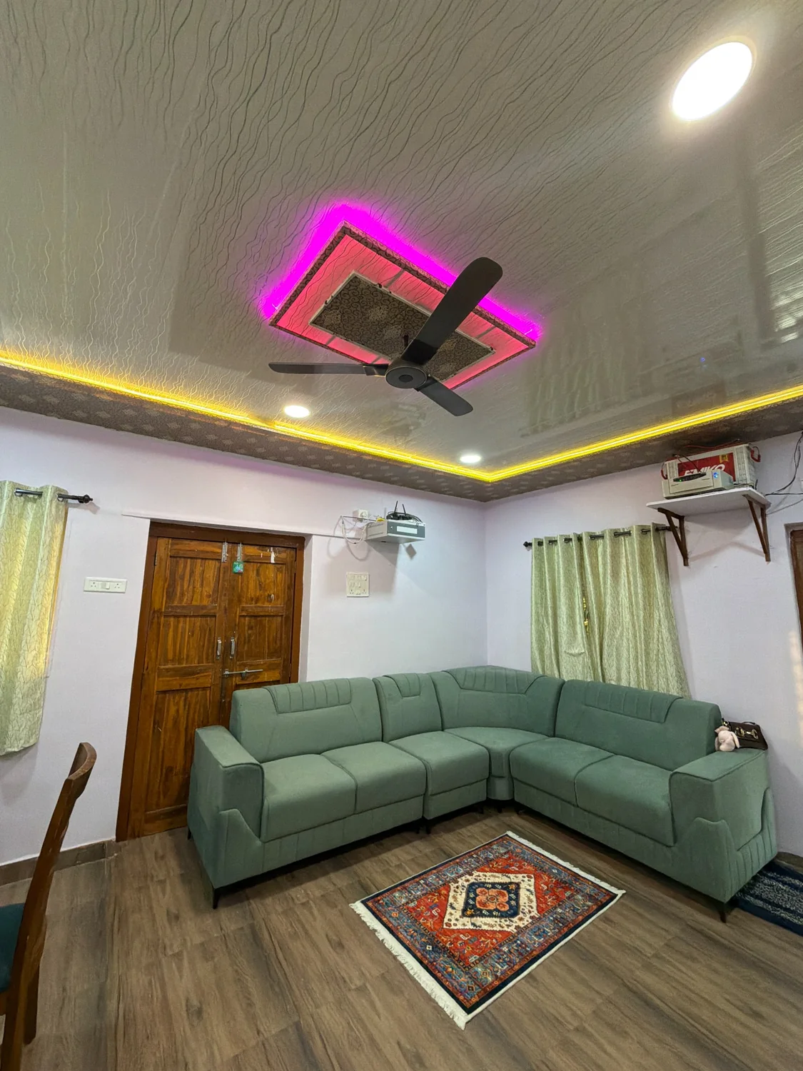 Comfortable living room sofa with false ceiling lights
